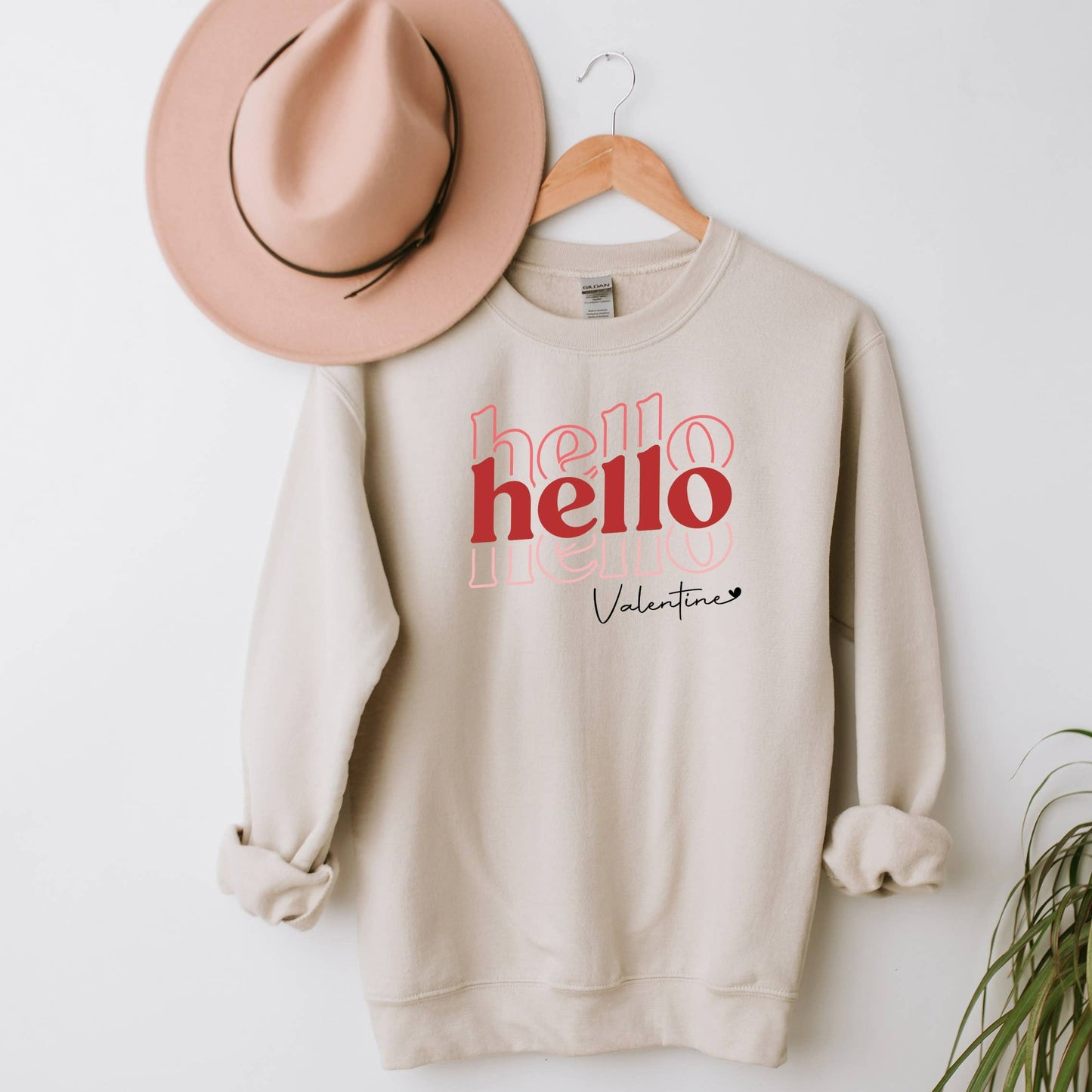 Sweatshirt that reads Hello Hello Hello Valentine.