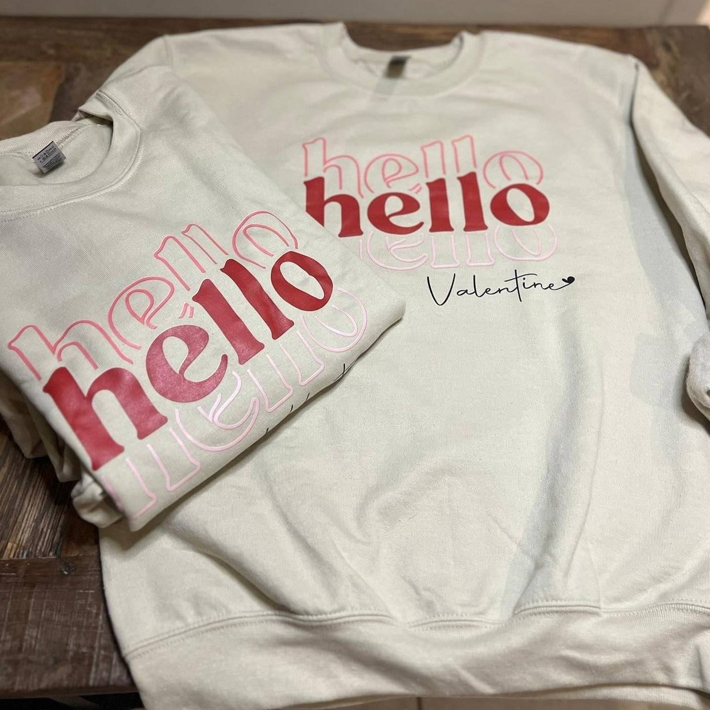 Sweatshirt that reads Hello Hello Hello Valentine. 